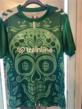 Hummel Green Graphic Soccer Jersey with Teal Skull Motif